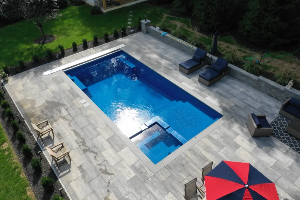Inground fiberglass pool installed by Leisure Pools Westchester in Harrison , NY