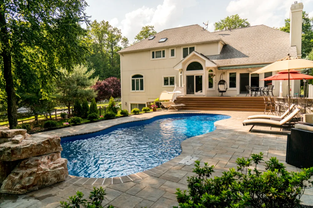 Inground fiberglass pool installed by Leisure Pools Westchester in Eastchester , NY