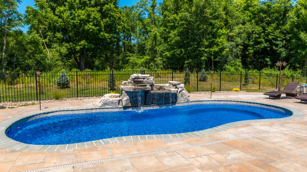 Inground fiberglass pool installed by Leisure Pools Westchester in Chappaqua, NY